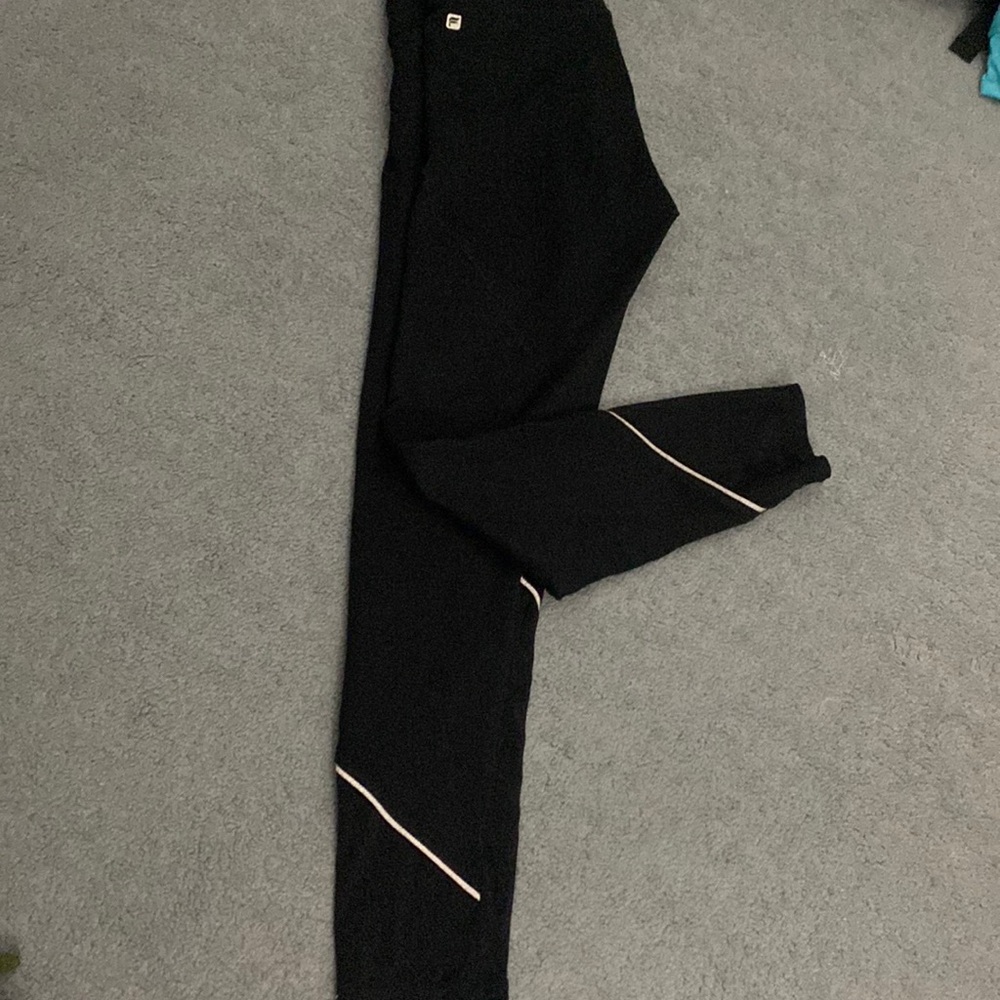 Black fabletic leggings with netting at the end